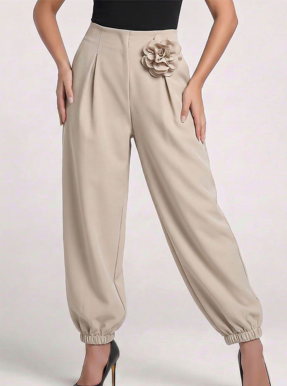 Beežid laiad püksid roosi kaunistusega